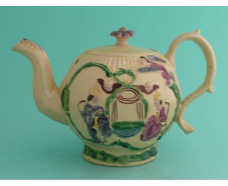 1761Coronation: a creamware teapot and cover of globular form moulded with seated crowned figures and painted in colours, 115