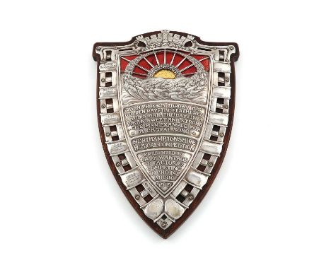 By Omar Ramsden and Alwyn Carr, an Edwardian silver and enamel presentation shield,London 1908,the shield with a pierced latt