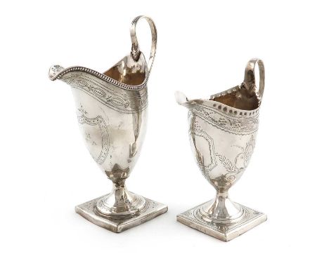 A George III silver cream jug,by Thomas Ollivant (of Manchester), London 1790,helmet form, bright cut decoration, reeded hand