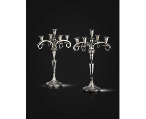 A pair of Austrian silver five-light candelabra,maker's mark JK, circa 1900-1920,tapering circular stems, on raised circular 