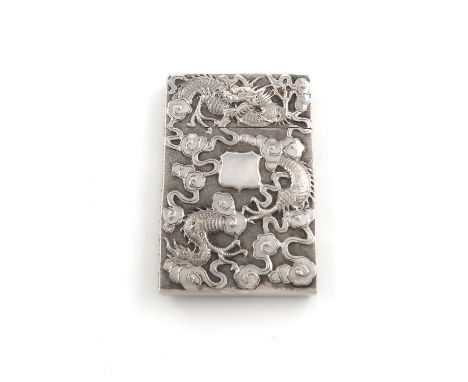 A 19th century Chinese silver card case,unmarked,rectangular form, embossed with dragons on a matted background, the reverse 