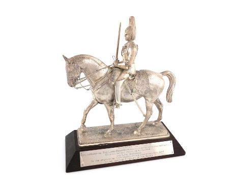 A silver model of a mounted Blues Officer, by H Phillips, London 1944,mounted on a later wooden plinth with a plaque inscribe