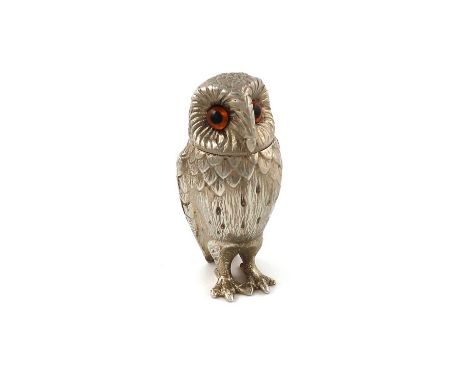 A silver model of an owl,by R. Comyns, London 1958,modelled in a standing position, textured feathers, pull-off head set with