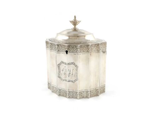 A George III silver tea caddy,maker's mark over-stamped, London 1787,fluted oval form, bright-cut decoration, initialled cart