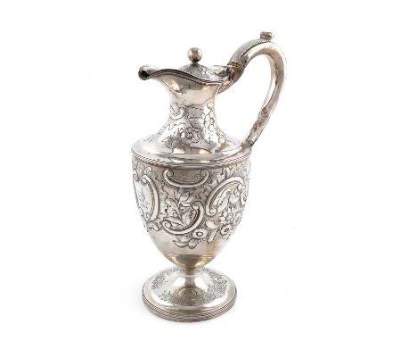 λA George III silver ewer,maker's mark worn, London 1800,vase form, leaf capped scroll handle with ivory insulators, later em