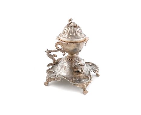 A Victorian silver inkstand,by Thomas Richards, London 1843,the central circular inkwell with foliate scroll handles, domed h