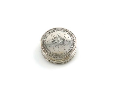 A George III silver patch box,by Cocks & Bettridge, Birmingham 1810,circular form, the pull-off cover with bright-cut floral 