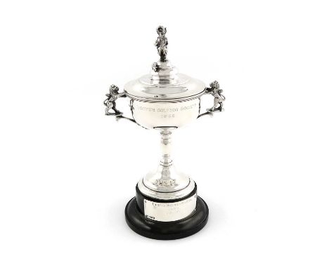 A silver twin-handled golfing trophy cup and cover,by Walker &amp; Hall, Sheffield 1936 and 1937,circular form, engraved 'LUC