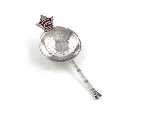 By R. E. Stone, a silver and enamel tea strainer, London 1936, also signed 'R. E. Stone',tapering handle with a crown finial,