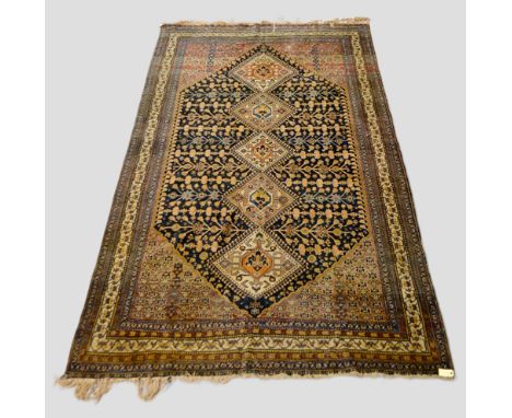 Qashqa’i carpet, Fars, south west Persia, early 20th century, 10ft. 8in. x 6ft. 3.25m. x 1.83m. Overall wear; small patch top