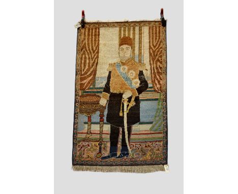 Tabriz pictorial rug, north west Persia, circa 1930s, 4ft. 3in. x 2ft. 9in. 1.30m. x 0.84m. Portrait probably depicting Reza 