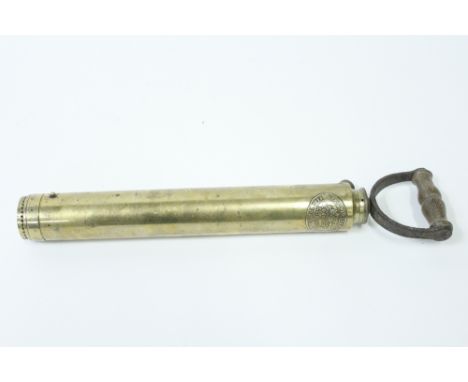 A 19th century brass Merryweather hand fire pump with inscription "Merryweather and son, Fire Engine makers, Long Acre, Londo