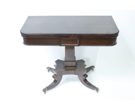 A 19th century rosewood veneer card table, on four splayed legs, on brass lion casters, 73cm high, 91cm long, 45cm wide, unop