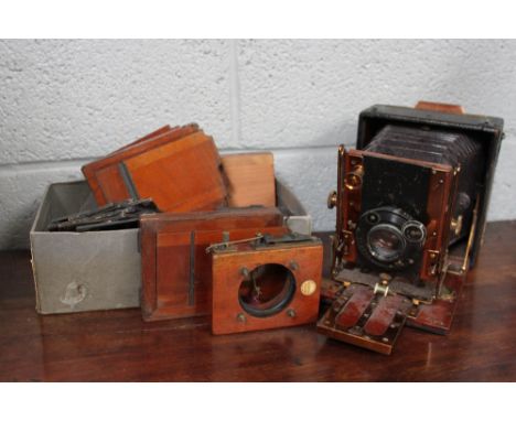 A collection of photographic slides, mostly of comical interest, along with a Sanderson brass and mahogany cased folding came