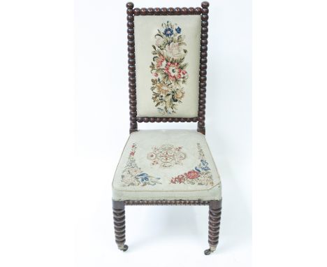 A Victorian Prie Dieu chair, on a bobbin frame, with a tapestry seat and back
