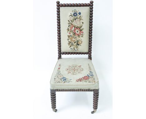 A Victorian Prie Dieu chair, on a bobbin frame, with a tapestry seat and back