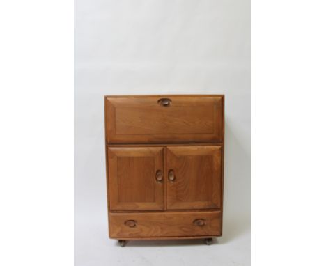 An Ercol Windsor light elm drinks cabinet, with drop down section, two door cupboard section and a single long drawer, 110cm 