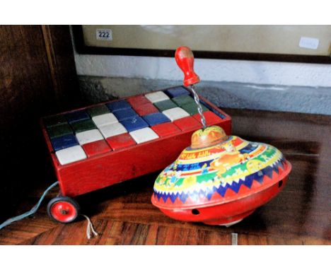 A Chad Valley spinning top, along with a set of toy wooden building blocks