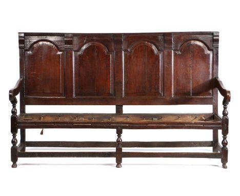 William &amp; Mary joined oak panel back settle, circa 1700, the rectangular back with four arched-fielded panels spaced by c