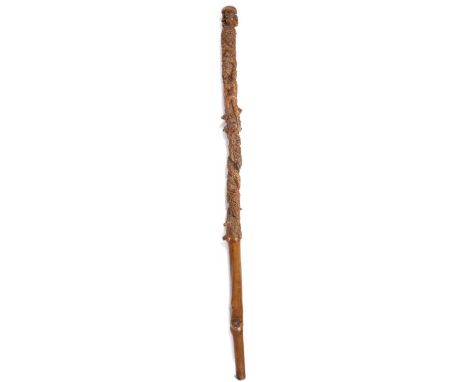 19th Century Folk Art walking stick/cane, the top surmounted by a monkeys head and a crouched monkey behind above the profuse