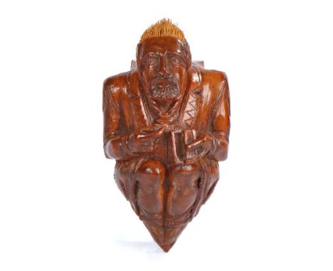 Rare late 18th Century treen figural Masonic coquilla nut snuff box, carved with bristles for hair holding snuff in one hand 