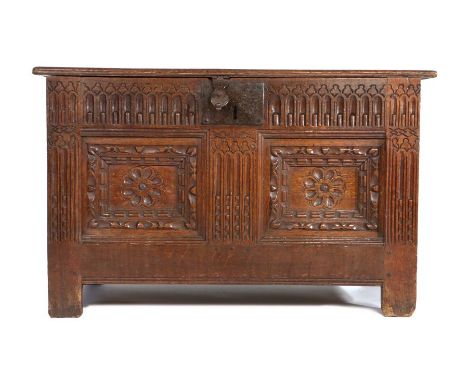 A good Elizabeth I oak coffer, circa 1600, Lancashire, of small proportions, the rectangular top with chip carved edge enclos