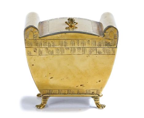 A George III engraved brass tea caddy, circa 1790, of Neo-Classical sarcophagus form, the hinged lid centred by a small ring-