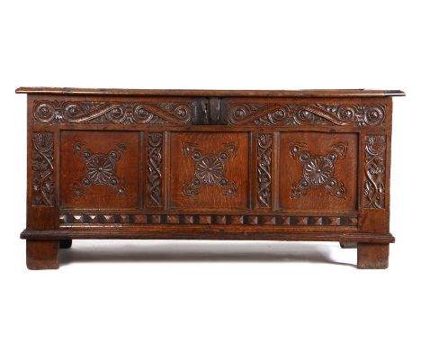 Charles I joined oak coffer, circa 1640, Gloucestershire, the rectangular four panel top enclosing storage space above scroll