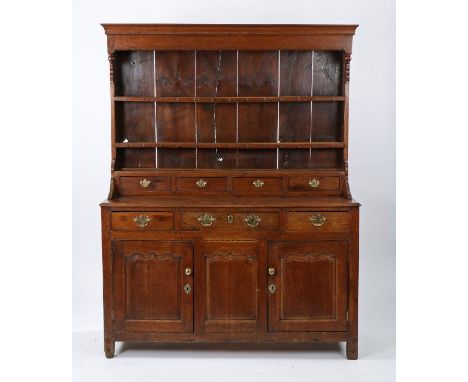 George I oak dresser and rack, North Wales circa 1760, the rack with a cavetto cornice and end pendants above three shelves a