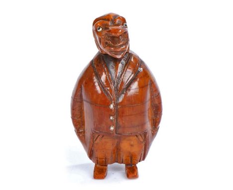 Late 18th Century treen figural coquilla nut snuff box, with a hooked nose and long chin above a jacket, his hands placed fir