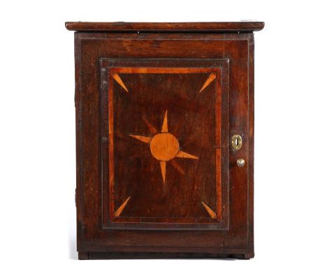 Early 18th century oak, yew and fruitwood inlaid small ‘spice’ cupboard, English, of show-tenon boarded construction, the sin