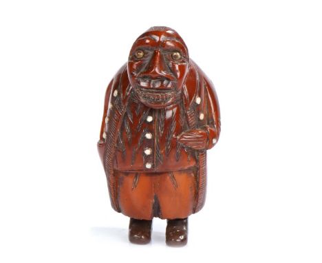 Late 18th Century treen figural coquilla nut snuff box, carved as a large man with hunched back, his jaw low depicting a row 