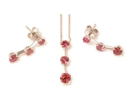 A pink tourmaline pendant and earrings, set with three graduated circular facet cut pink tourmalines, on 18ct white gold knif