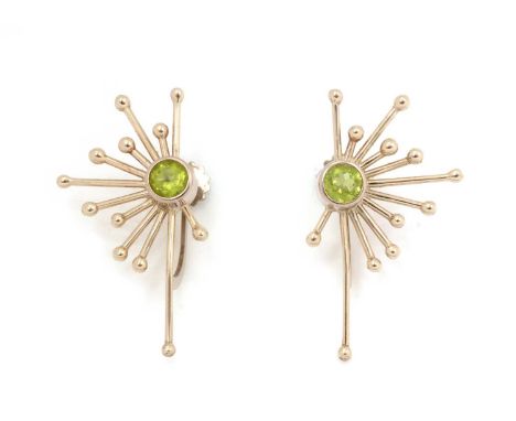 A pair of limited edition peridot earrings by Catherine Best, no.3 in Fireworks pattern, each set with single circular facet 