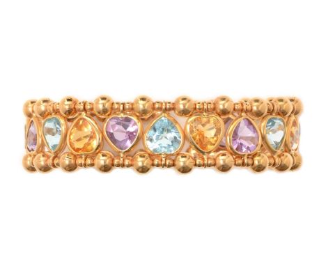 A topaz, citrine and amethyst bangle, alternately set with six heart cut blue topaz, amethysts and citrines, in 18ct yellow g