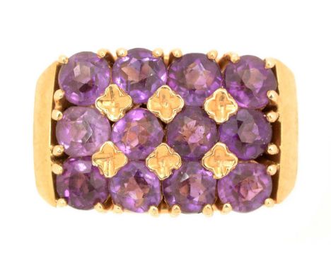 A mid-20th Century amethyst dress ring, set with twelve circular facet cut amethysts, on 14ct yellow gold mount and shank, ri