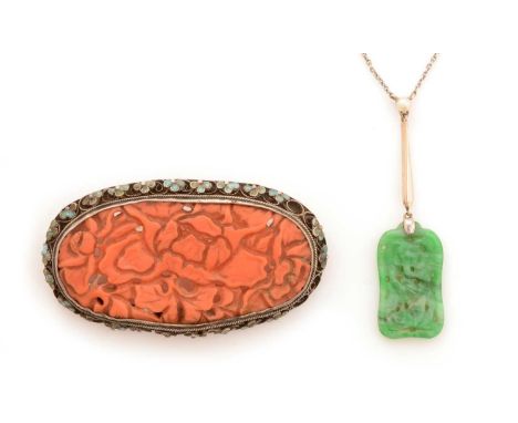 An early 20th Century Chinese jade and seed pearl pendant, the carved jade panel with floral designs, on bar stamped '9ct' ha