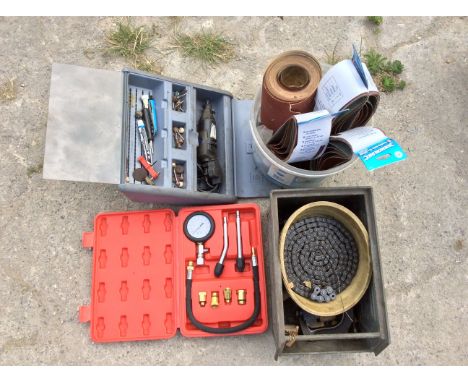 Various tools and ancillaries plus a motorcycle drive chain.