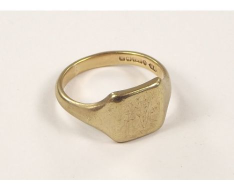 GOLD RING. A gentleman's 9ct. gold signet ring with rubbed engraved Masonic emblem. Size W. Approx. 7.1g.