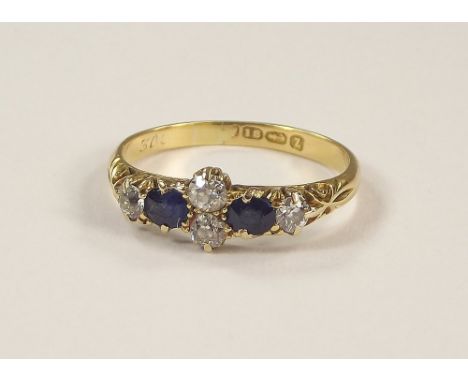 GOLD RING. A Victorian 18ct. gold, six stone sapphire & diamond ring. Size P.