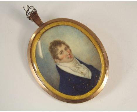 PORTRAIT MINIATURE.An early 19th century portrait miniature of a gentleman with white waistcoat & blue topcoat, hand painted 