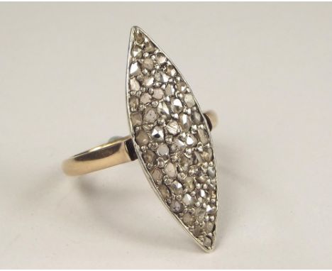 DIAMOND RING. A yellow metal marquise ring, set throughout with old cut diamonds. Face, 3x 1cm. Size S.