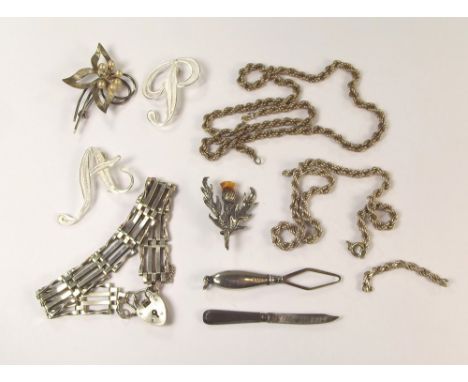 SILVER CHAINS ETC. Two silver rope twist chains, a silver gate bracelet with padlock, brooches etc.