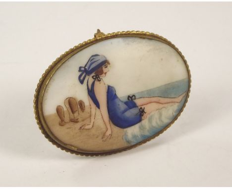 ART DECO PLAQUE.An Art Deco transfer printed & hand painted porcelain plaque, showing a lady bather. Brass easel strut frame.