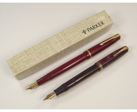 FOUNTAIN PENS.A Parker Slimfold fountain pen, with box & instruction leaflet & a Canadian striated Parker Vacumatic fountain 