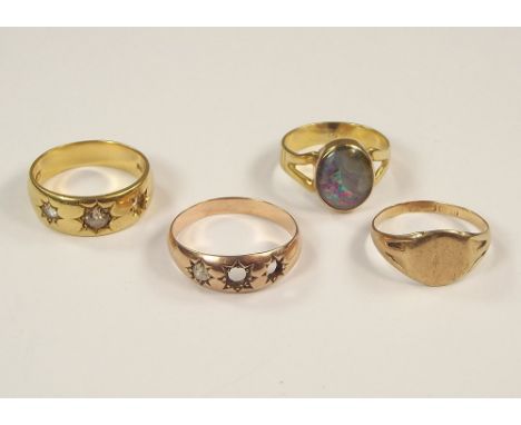 GOLD RINGS. Scrap gold rings in 18ct. (approx. 8g), a 9ct. gold signet ring (approx. 1.9g) & one other unmarked ring.