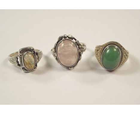 SILVER RINGS. Two silver rings, one set with moss agate, the other rose quartz & one other ring.