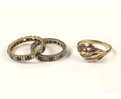 GOLD RINGS. A 9ct. gold leaf dress ring, a 9ct. white gold full hoop eternity ring & one other full hoop eternity ring.