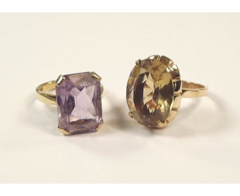 DRESS RINGS. A 9ct. gold & amethyst set dress ring, size P/Q & one other unmarked dress ring, size Q.