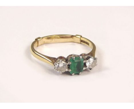 GOLD RING. An 18ct. gold & platinum, emerald & diamond ring, with 9ct. gold spacer. Size with spacer M/N.